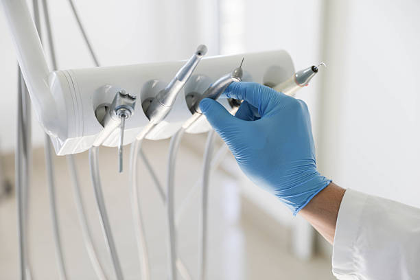 Professional Tooth Extraction technician working in Potterville, MI